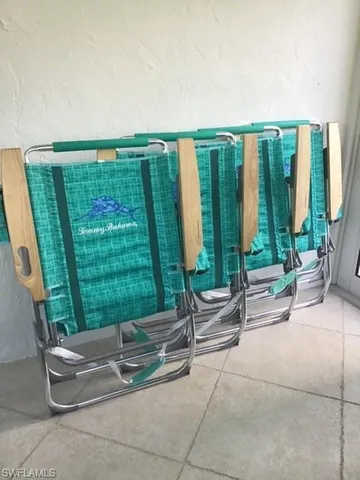 a view of a house with backyard porch and sitting area