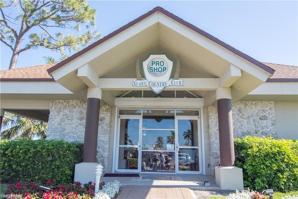 195 Peppermint Lane, Unit 881 Naples, FL 34112 - Photo 23 of 35 a front view of a house with garden