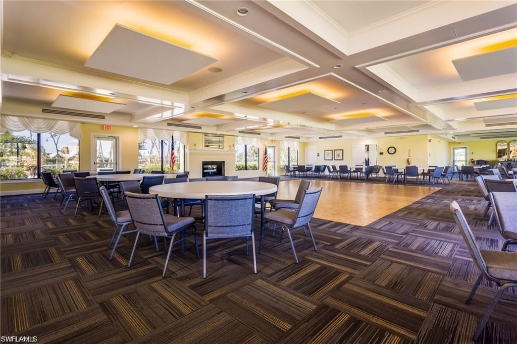 195 Peppermint Lane, Unit 881 Naples, FL 34112 - Photo 27 of 35 a view of a dining room with furniture window and wooden floor