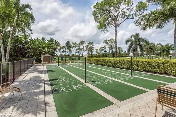 a view of swimming pool with outdoor seating and barbeque oven