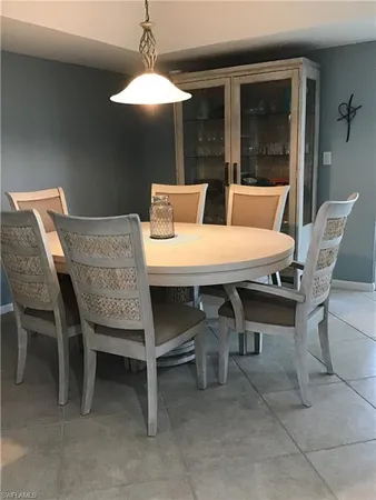 a dining room with a table and chairs