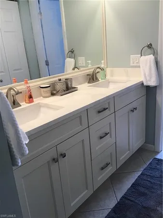 a bathroom with a sink and vanity