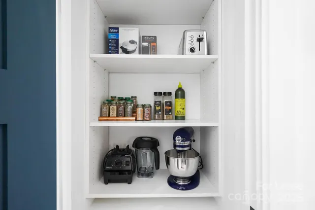 a shelf with books and knick knacks on it