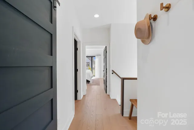 a bedroom with a bed and large window
