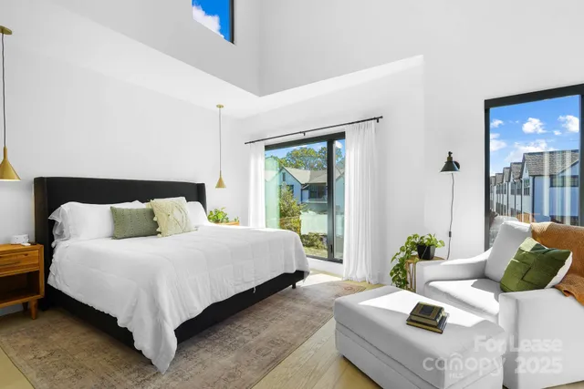 a bedroom with a bed and ceiling fan