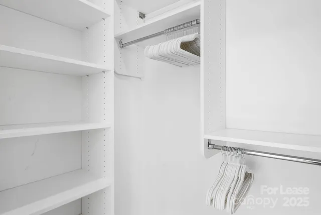 a bathroom with a double vanity sink mirror and shower