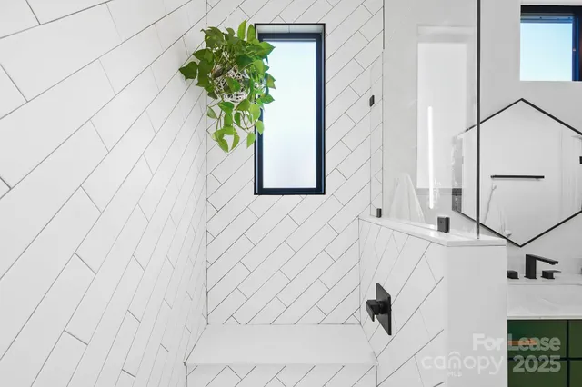 a bathroom with a sink vanity and mirror