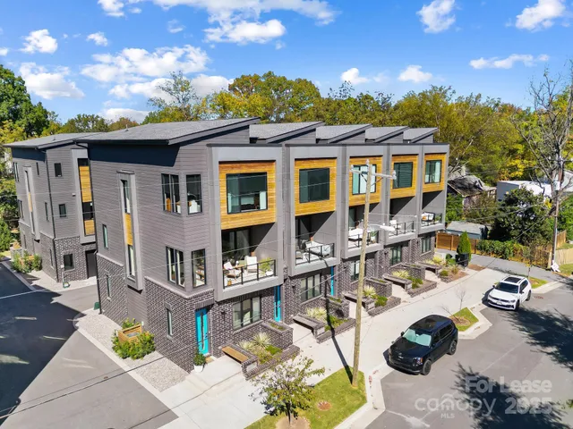 a view of a patio with swimming pool and furniture