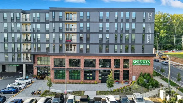 a view of swimming pool with outdoor seating and trees