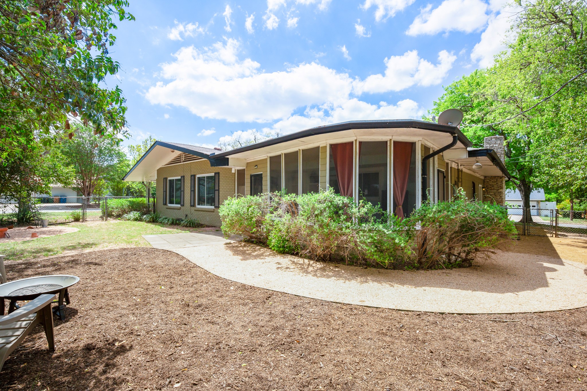 4702 Lasso Path Austin, TX 78745 - Photo 7 of 34 a front view of a house with garden