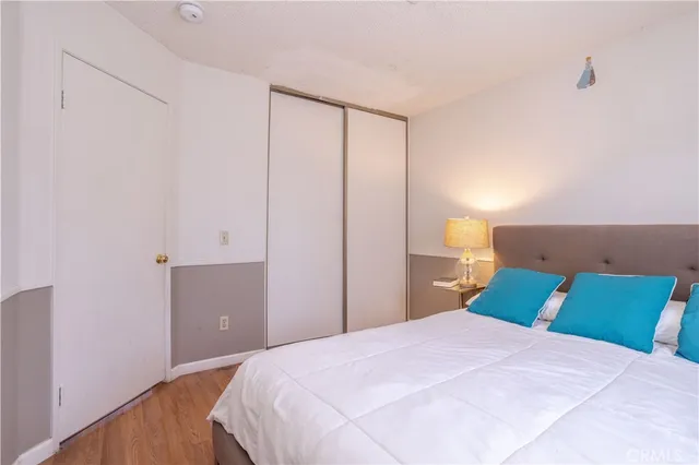 a bedroom with a bed and a closet