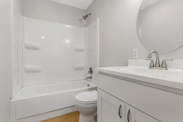 a bathroom with a sink a toilet and a bathtub