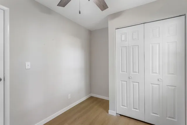 an empty room with wooden floor