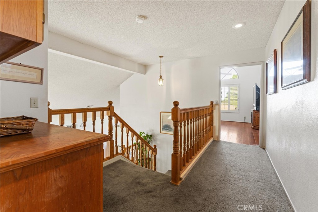 2323 Golden Lancaster, CA 93536 - Photo 15 of 34 a view of a hallway to a livingroom with wooden floor and furniture