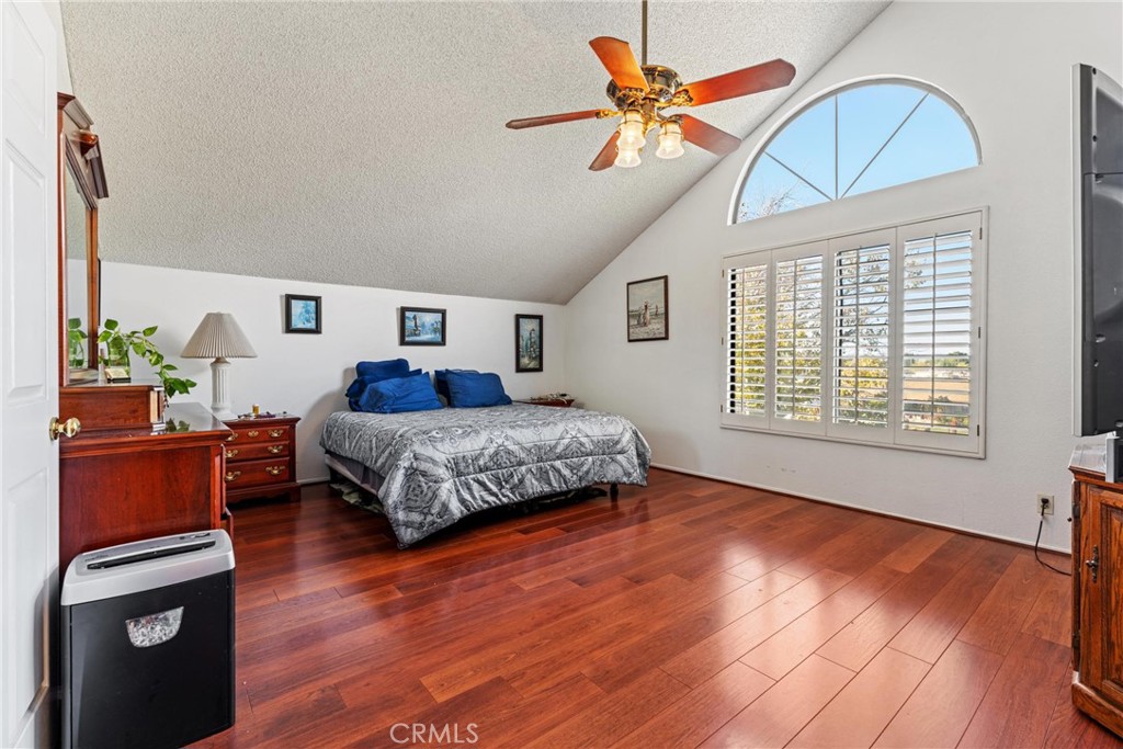 2323 Golden Lancaster, CA 93536 - Photo 20 of 34 a bedroom with a bed and a chandelier