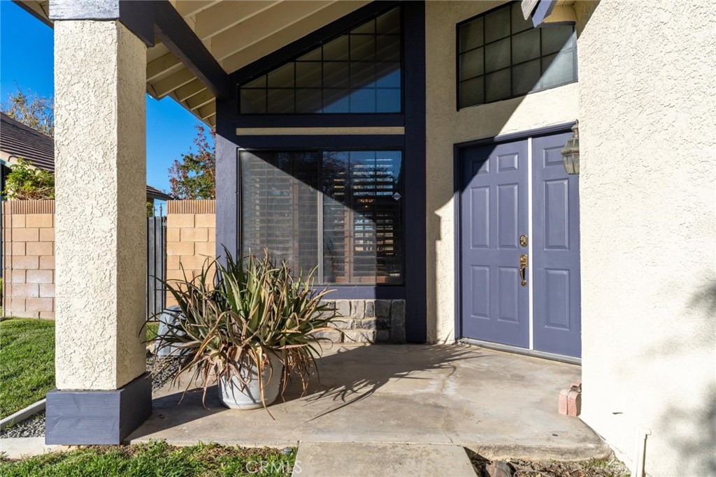 2323 Golden Lancaster, CA 93536 - Photo 2 of 34 a potted plant in front of a door