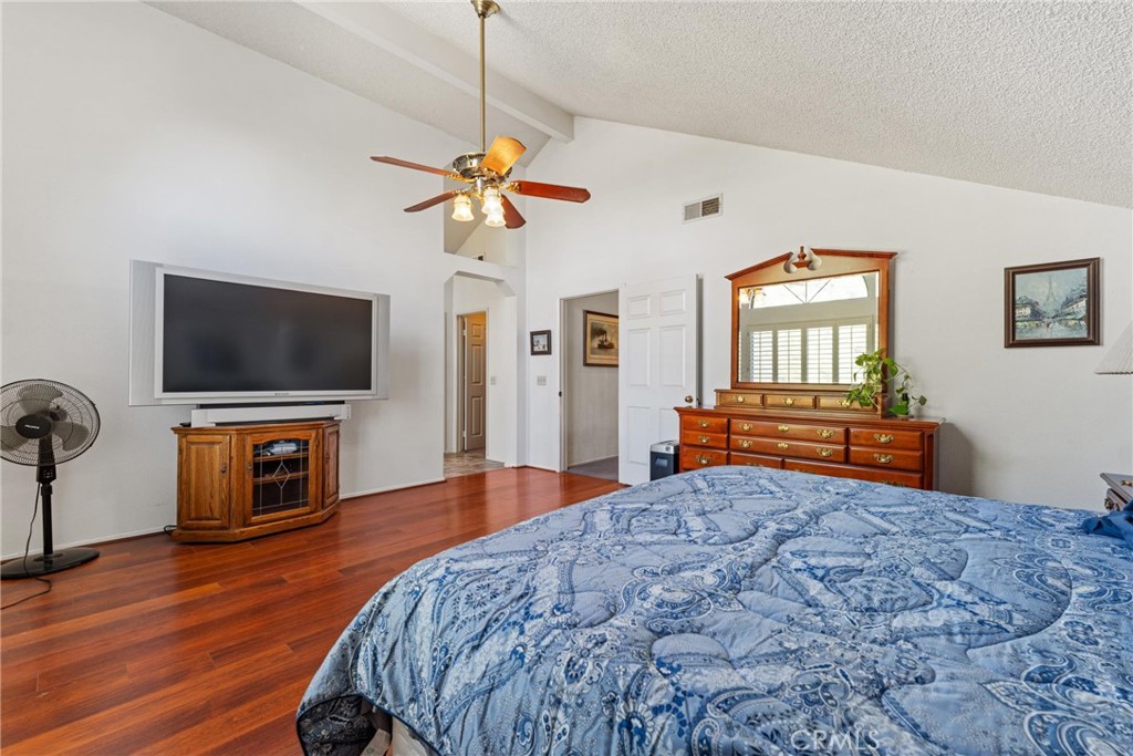 2323 Golden Lancaster, CA 93536 - Photo 21 of 34 a bedroom with a bed and a flat screen tv