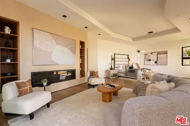 a white bath tub sitting in a bathroom next to a window