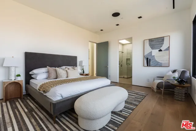 a bathroom with a shower and a sink