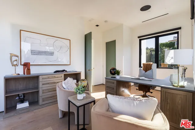 a view of a livingroom with furniture and hardwood floor