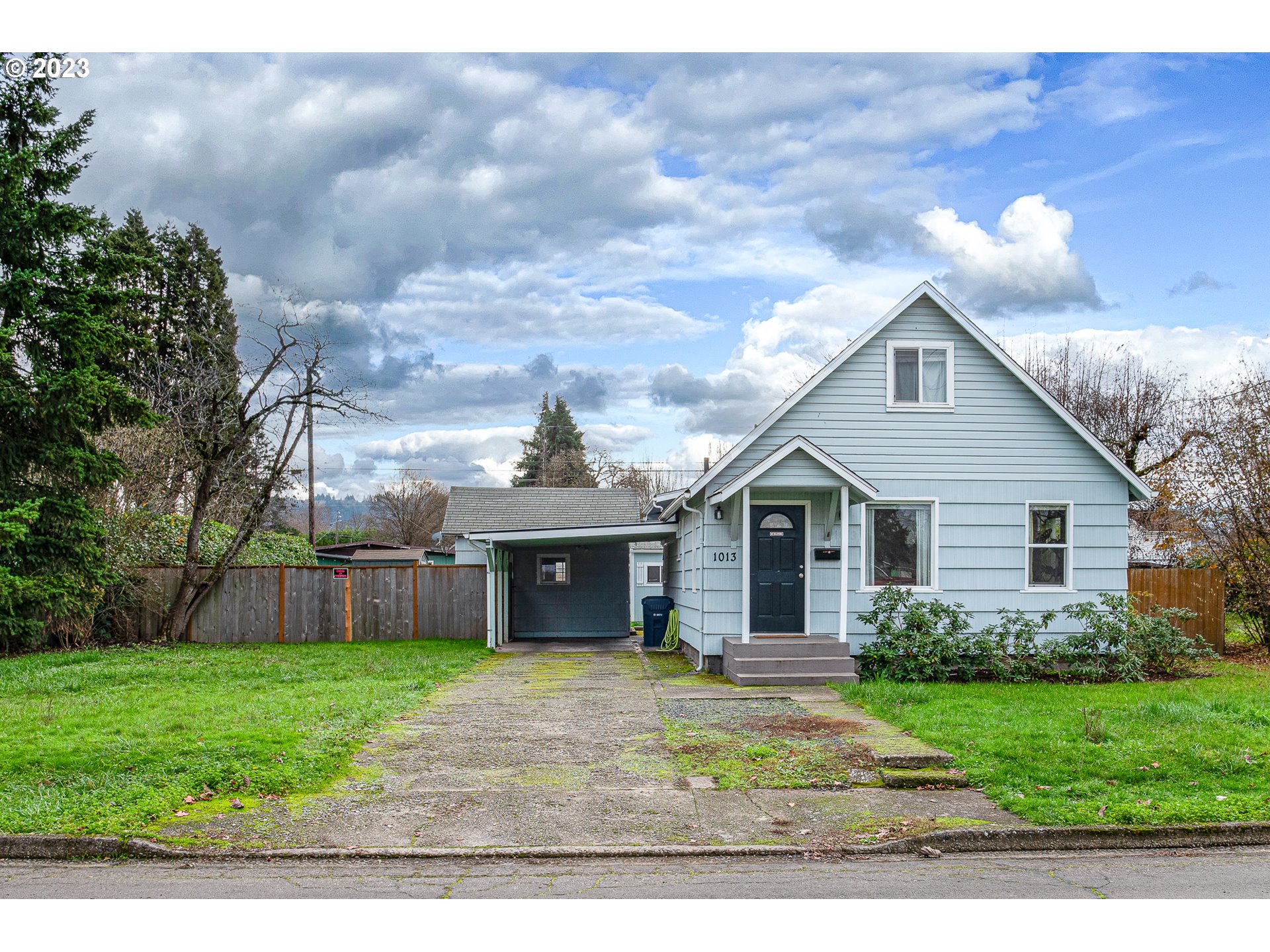 1013 M Street Springfield, OR 97477 - Photo 31 of 35 a front view of house with yard and green space