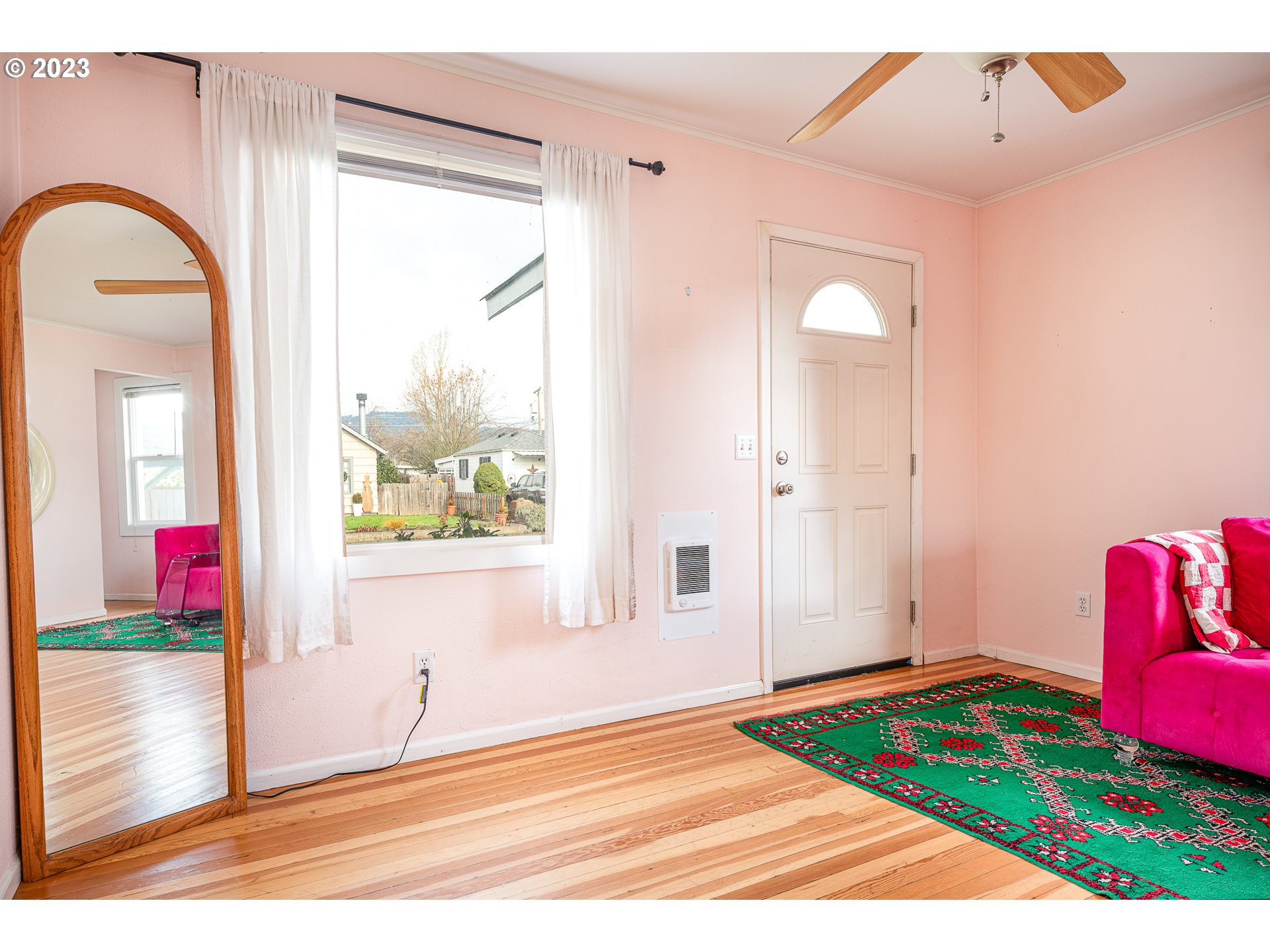 1013 M Street Springfield, OR 97477 - Photo 4 of 35 a view of a bedroom with window and wooden floor
