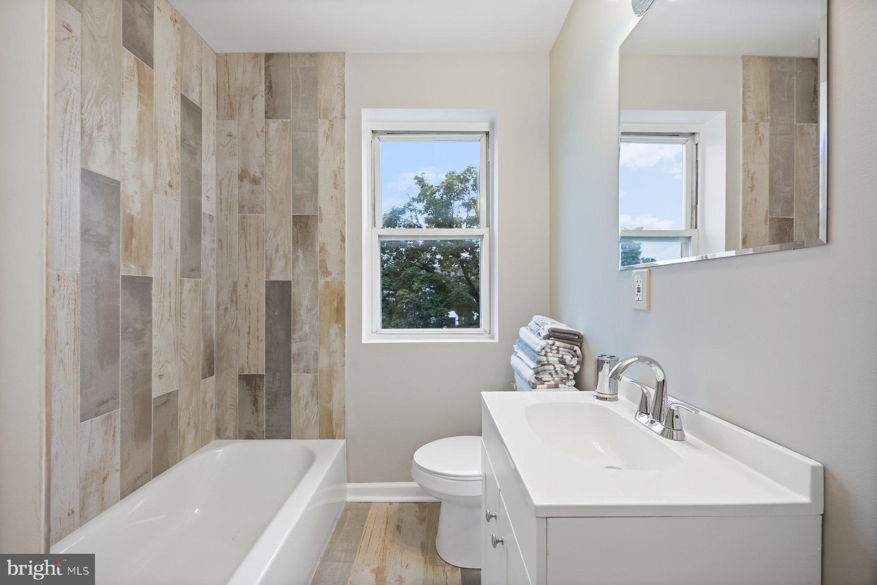 1526 Sheffield Road Baltimore, MD 21218 - Photo 13 of 20 a bathroom with a sink toilet and shower