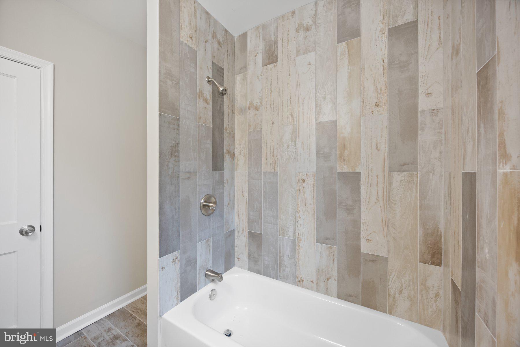 1526 Sheffield Road Baltimore, MD 21218 - Photo 14 of 20 a bathroom with a bathtub and shower