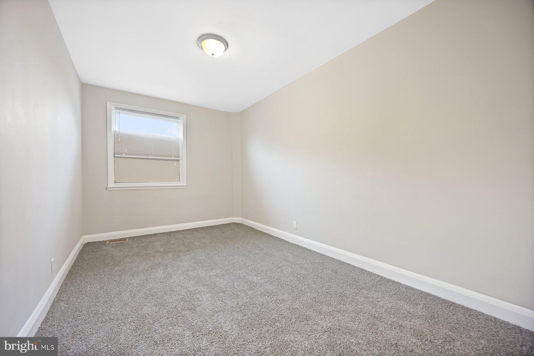 1526 Sheffield Road Baltimore, MD 21218 - Photo 17 of 20 an empty room with a window