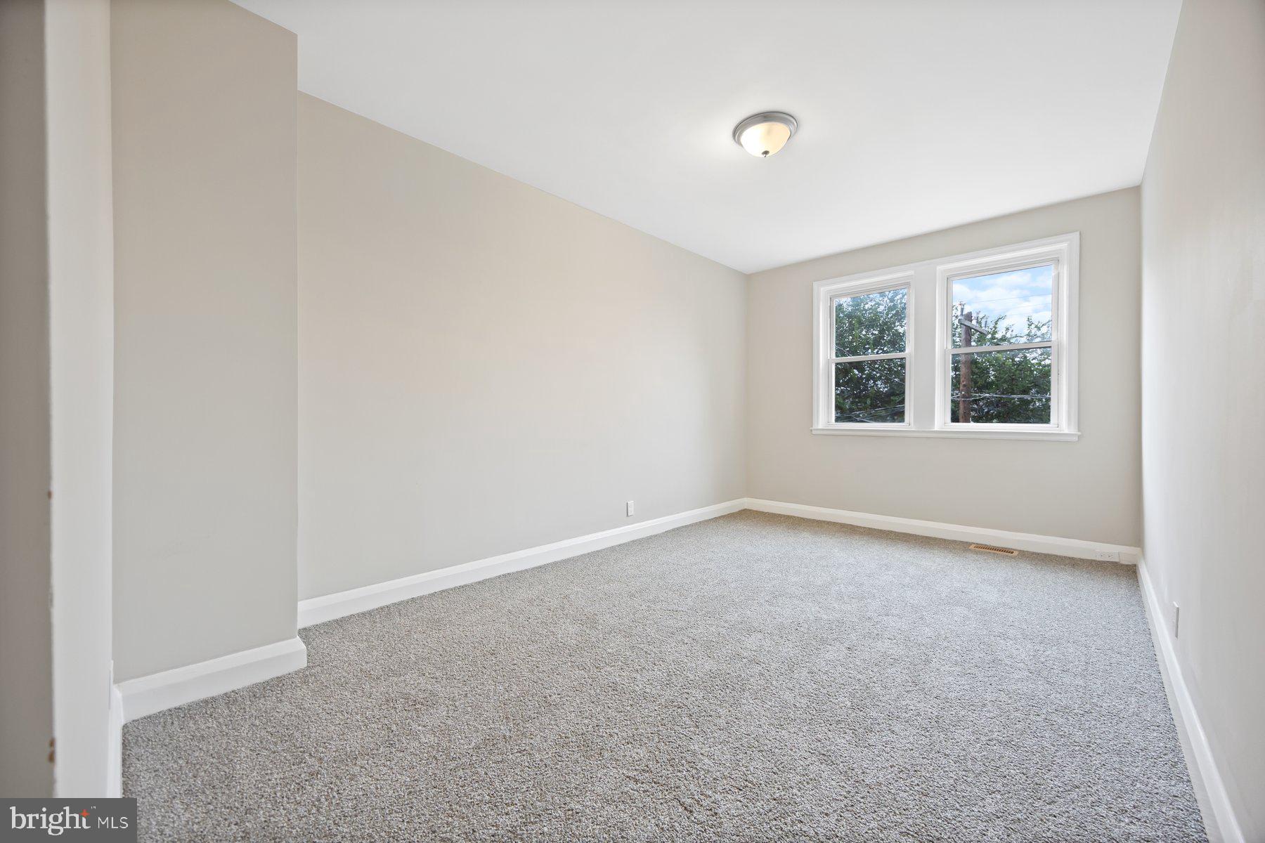 1526 Sheffield Road Baltimore, MD 21218 - Photo 18 of 20 an empty room with a window