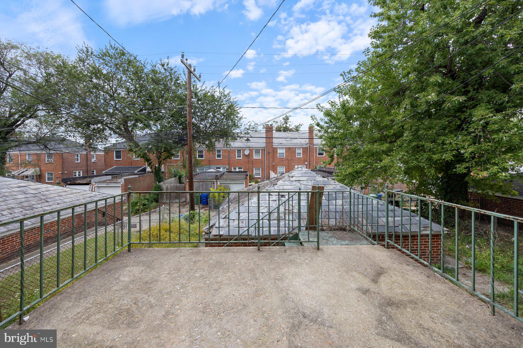 1526 Sheffield Road Baltimore, MD 21218 - Photo 20 of 20 a view of street with wooden fence