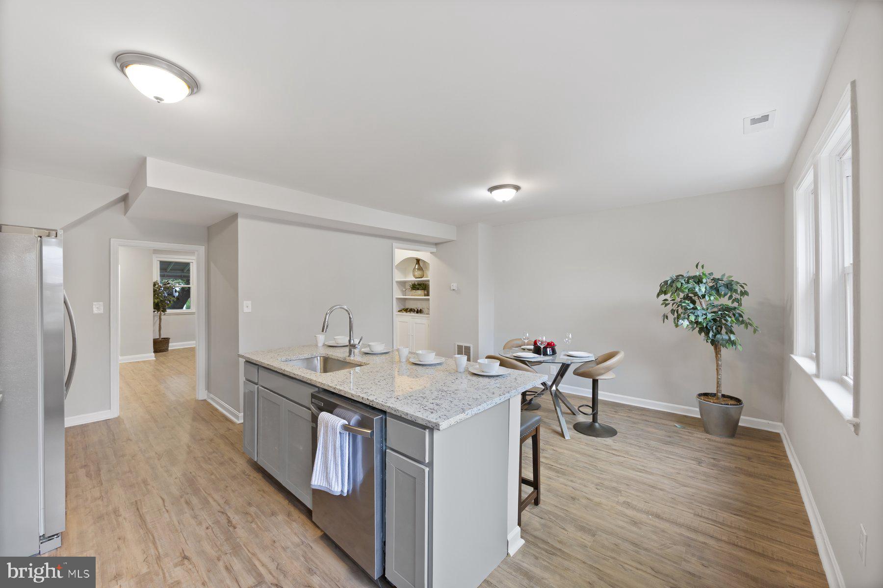 1526 Sheffield Road Baltimore, MD 21218 - Photo 2 of 20 a view of a kitchen with a table and chairs