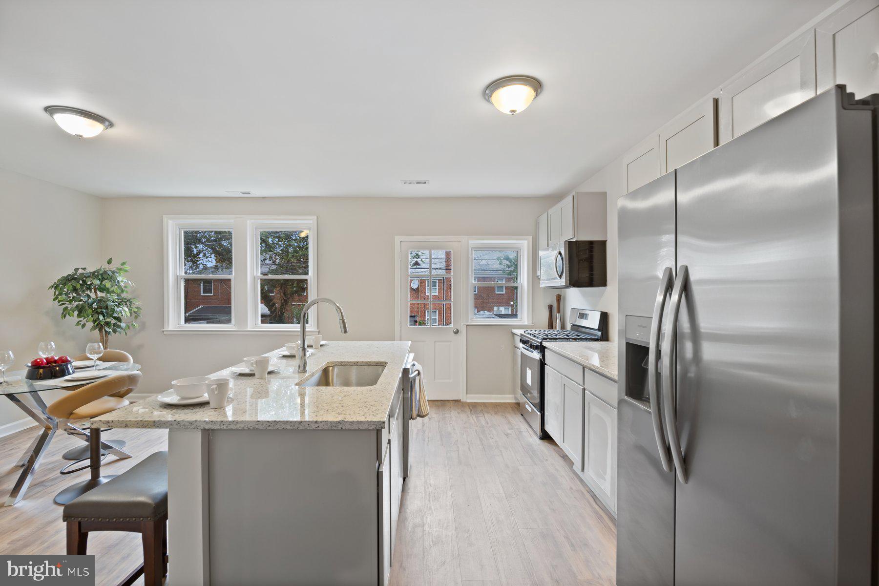 1526 Sheffield Road Baltimore, MD 21218 - Photo 5 of 20 a kitchen with refrigerator cabinets and furniture