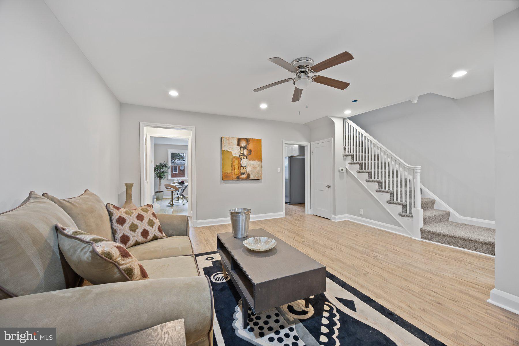 1526 Sheffield Road Baltimore, MD 21218 - Photo 7 of 20 a living room with furniture and a wooden floor