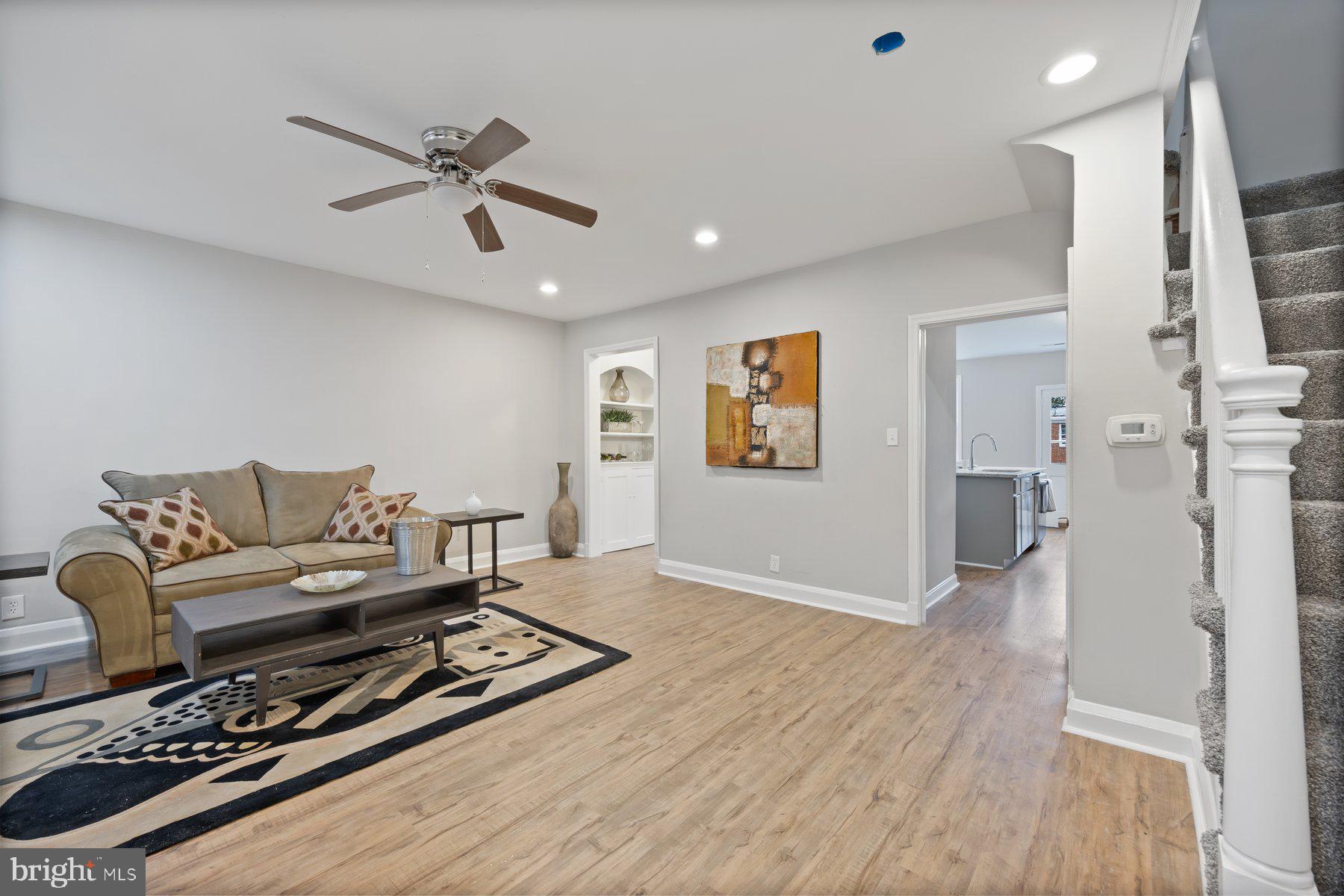 1526 Sheffield Road Baltimore, MD 21218 - Photo 8 of 20 a living room with furniture and a wooden floor