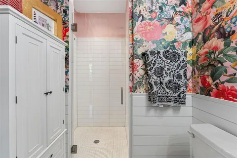 a spacious bedroom with a bed and a window