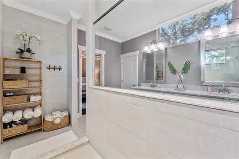 a bathroom with a sink a toilet a tub and shower