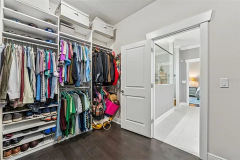 a bed room with a bed and a walk in closet