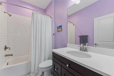 a bed room with furniture and a flat screen tv