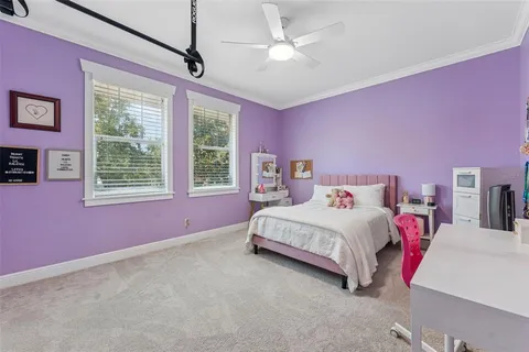 a bathroom with a granite countertop toilet sink and mirror
