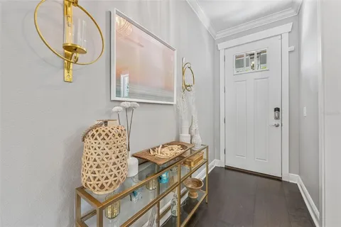 a view of living room with furniture and wooden floor