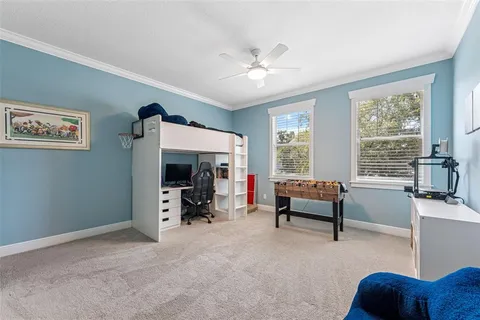 a couple of chairs sitting in backyard of a house