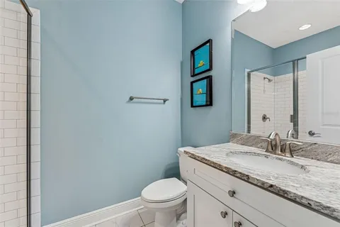 an aerial view of a house with outdoor space and lake view