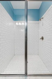 an aerial view of a house with a yard and lake view