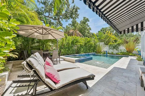 a potted plant sitting in front of a door