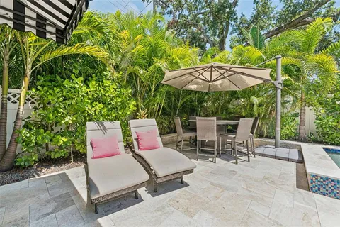 a front view of a house with a garden and yard