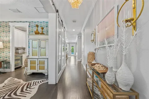 a living room with a bed and a window