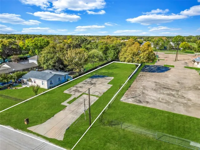 a view of a garden with an ocean