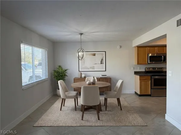 a view of a dining room with furniture