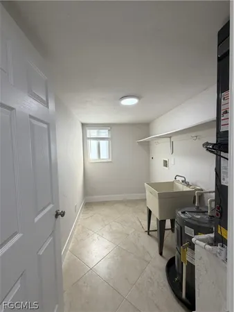 a view of a room that has a table and chairs in it